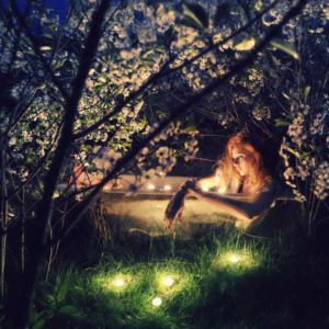 girl in a outdoor bath, at night, moon gazing surrounded by candles